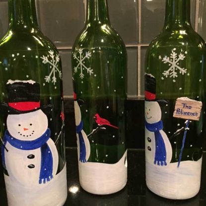 hand painted bottles with sign