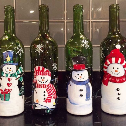 four hand painted snowman wine bottles
